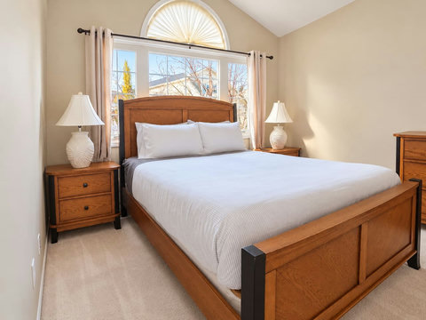 Alternate view of the primary bedroom and queen bed.