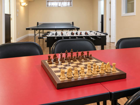 Chess and board-game table in the basement games room.