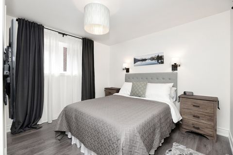 Queen size bed with firm mattress and soft memory foam topper,  blackout curtains.