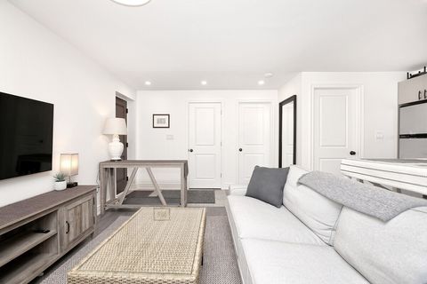 Comfortable sofa to lounge in front of 55 inch 4K TV.