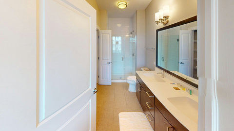 Master bathroom with double sink vanity and shower and tub