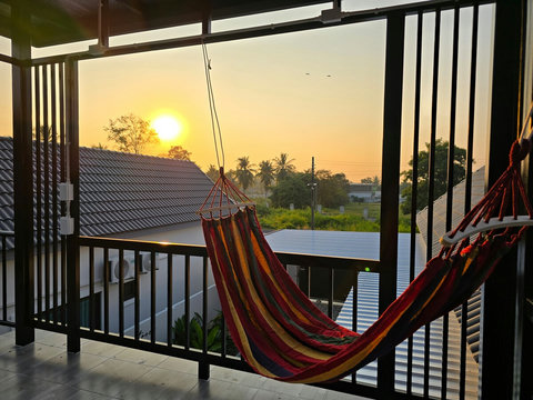 Balcony with hammock, a calm spot to breathe in Thailand’s warm natural air.