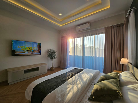 Smart TV (55") and private attached bathroom.