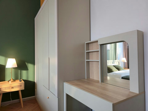 Stylish vanity and wardrobe for your convenience.