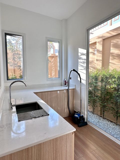 Extra prep area in laundry room 
(iron, board, and cleaners)