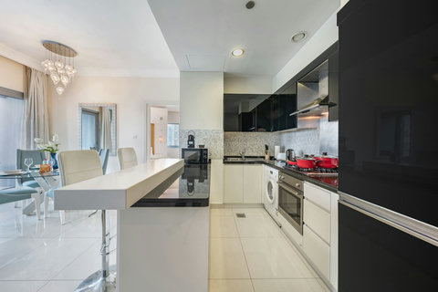The kitchen is fully equipped with modern appliances and ample storage.