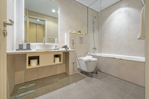 A sleekly designed bathroom, offering a comfortable and inviting space for your personal care with modern fixtures and stylish finishes.