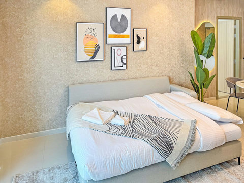 The convertible queen sofa bed offers you a cozy spot to relax while enjoying floor-to-ceiling window views of the city and waterfront.