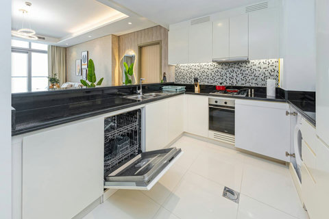 The kitchen is fully equipped with modern appliances and ample storage. It includes a large fridge, stove, oven, microwave, and a dishwasher making it ideal for your meal preps.