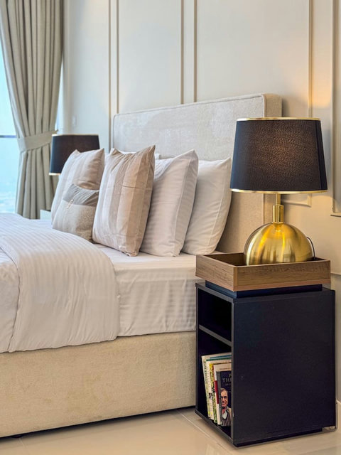 Beautifully decorated nightstand adds a touch of charm and functionality to the room.