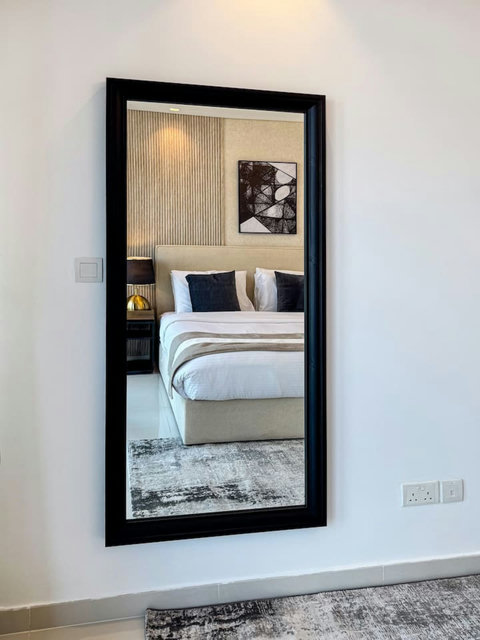 Includes a full-length mirror that complements the stylish decor for additional functionality.