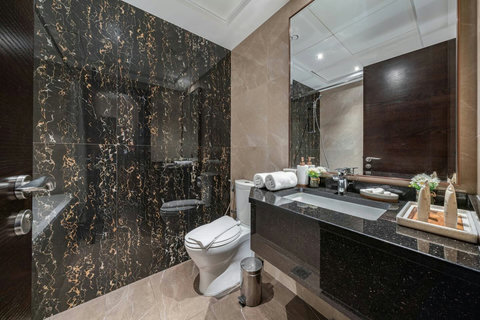You’ll have a spacious bathroom with a full bathtub and shower, plus the basic essentials you need for a comfortable stay.