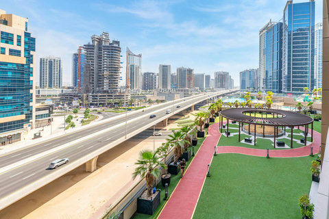 Enjoy a cozy balcony sitting area for two with uninterrupted views of Dubai's bustling city.