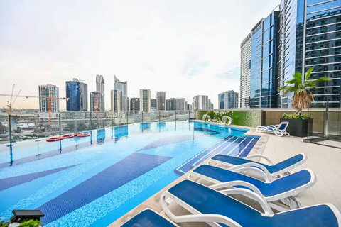 Take a dip or relax by the pool with free access while enjoying views of the iconic Burj Khalifa.