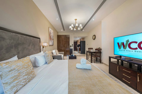 Wake up in a bright room with a plush king bed, modern lighting, and views of Downtown Dubai—perfect for an amazing stay!