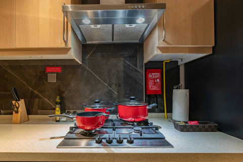 Cook up in a fully equipped kitchenette with modern appliances and plenty of storage.