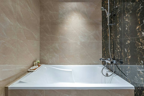 You’ll have a spacious bathroom with a full bathtub and shower, plus the basic essentials you need for a comfortable stay.