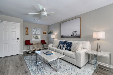 Living Room: Bright space with modern decor, perfect for relaxing or entertaining after beach days!