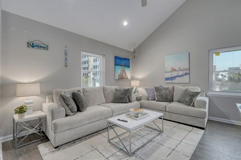 Living Room: Bright and airy space with plush seating and beachy decor—perfect for relaxation!