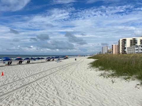 Beachfront Bliss: Known for being one of the widest points on the grand strand! 
 Stroll along soft sands, sip cocktails under colorful umbrellas, and soak in the sun!