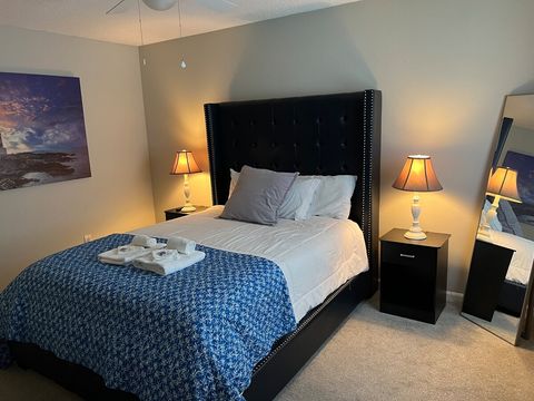 Bedroom Retreat: Tranquil space with plush bedding, stylish decor, and warm lighting awaits!
