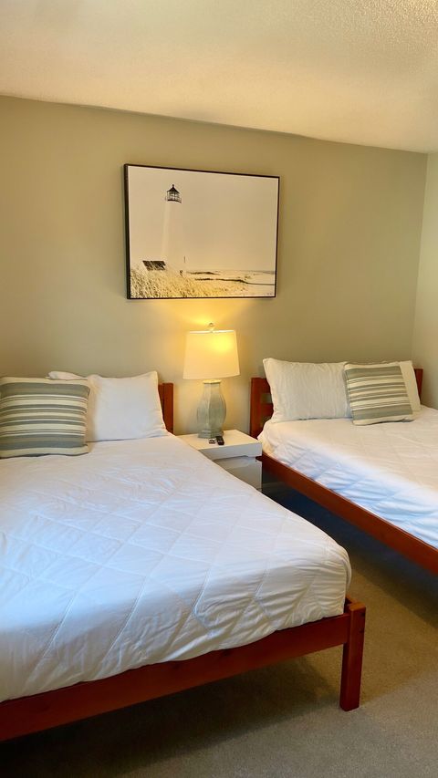 Guest Room: Bright and airy with soft lighting and coastal decor for the perfect beach retreat!
