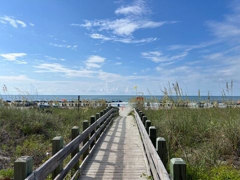 Beach Access: Stroll down the wooden path to sun-kissed sands and endless ocean views!