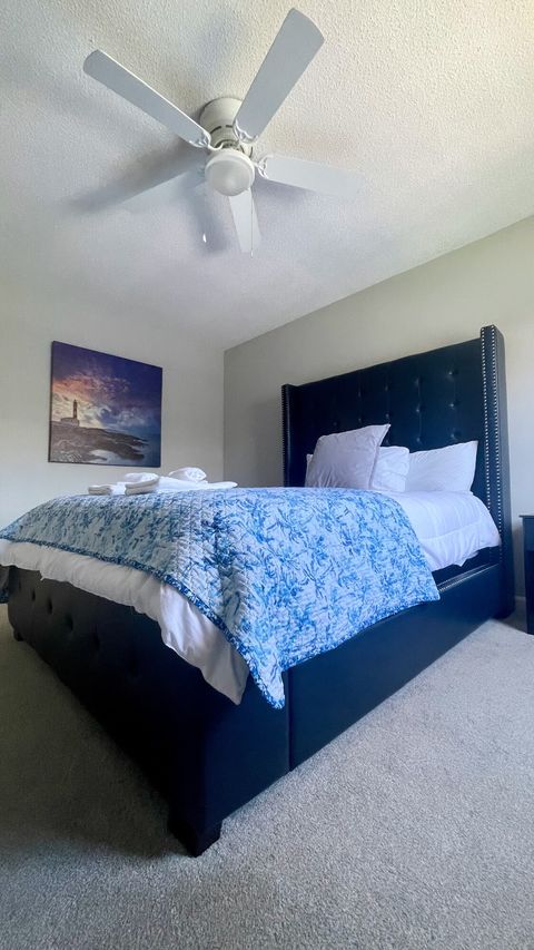 Bedroom Retreat: Relax in luxury with plush bedding and serene coastal decor near the beach!