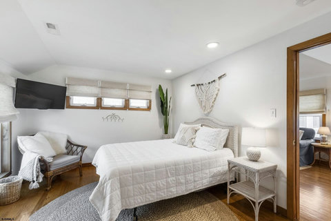 Primary bedroom with tv