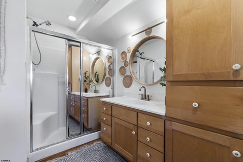 Bathroom with shower and washer dryer