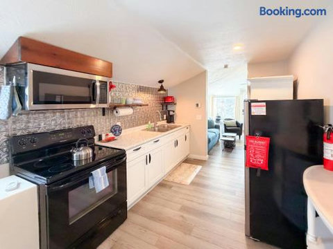 Bright modern kitchen with full-size appliances and stylish backsplash