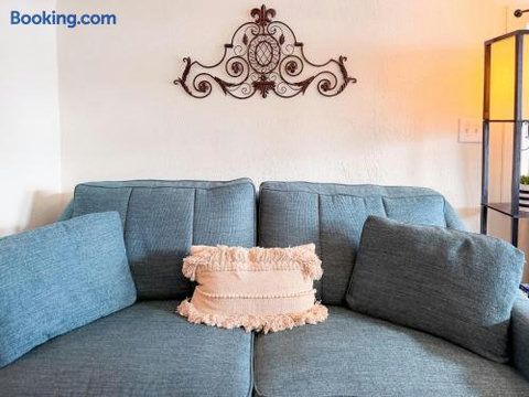 Cozy blue sectional with stylish décor and warm, inviting touches
