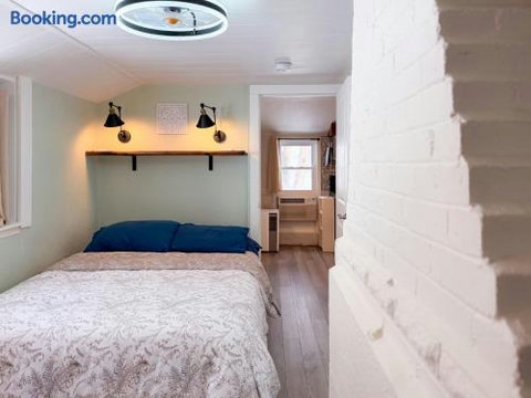 Cozy bedroom with warm lighting and a bright, efficient layout