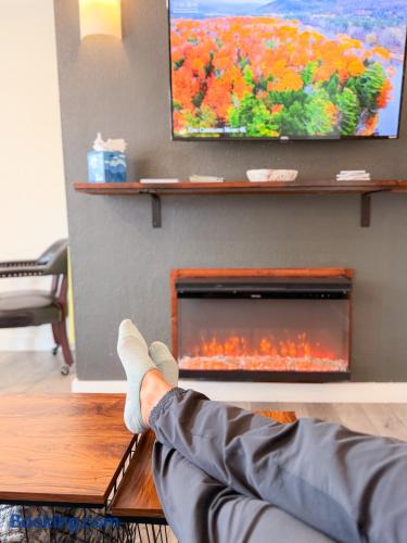 Cozy lounge with electric fireplace and TV for relaxing nights in