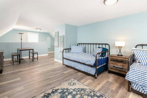 Game and snack table, dresser, bedside table and a full length mirror makes this a great room for kids or adults!