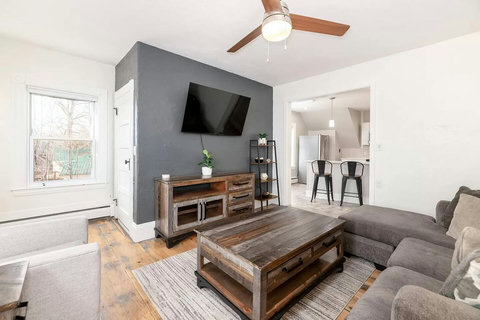 Big Roku TV with games and blankets in the cabinet for fun and comfort!