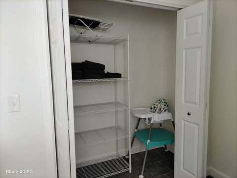 Downstairs bathroom closet with easy clean high chair.
