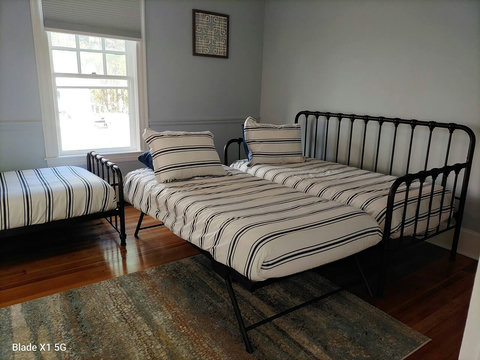 Downstairs bedroom with trundle setup and twin bed. 
