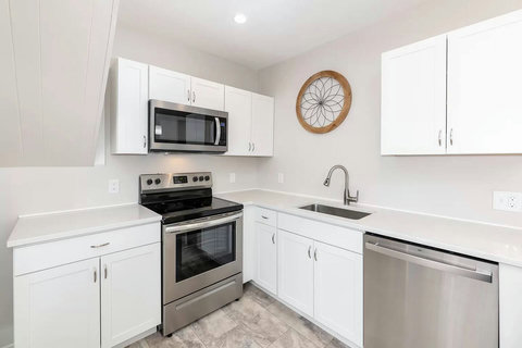 Full size flattop stove with oven and big dishwasher makes cooking and cleanup easy peasy! Fully equipped with pots, pans, baking items, a variety of knives, cutting boards, dishes and silverware (for kids and adults), utensils and more.