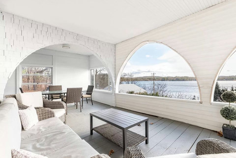 Front porch offers plenty of visiting and eating space!