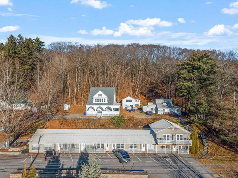 Wide view of condo property from drone
