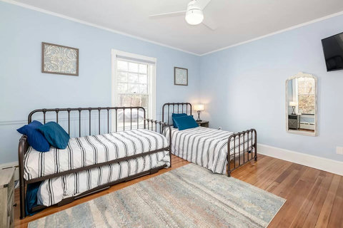 Downstairs second bedroom sleeps 3 with a twin and a trundle bed. Roku TV and a super quiet AC in the summer.