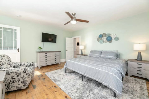 Upstairs King bedroom and access directly to the sunroom views! Super quiet AC in the summer and Roku TV.