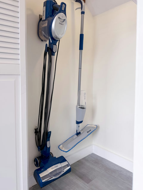 Shark vacuum and Bona mop in downstairs closet so you can keep things tidy during your stay — a well-stocked, thoughtfully managed home.
