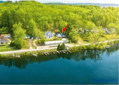 Peaceful waterfront retreat surrounded by trees and scenic lake views