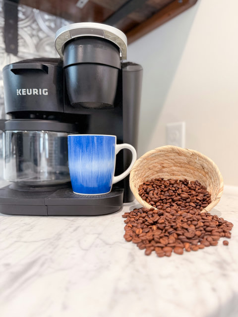 Start every morning right — dual-brew Keurig with blue mugs to match the lake outside.