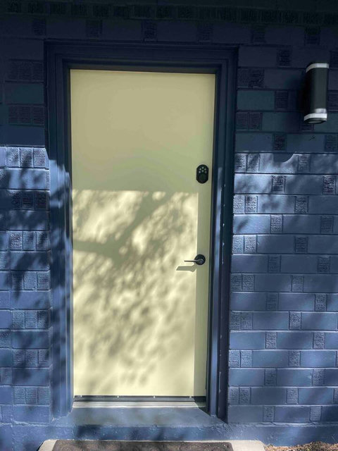 This is the main door you will use 
Self check in 
You only need the code to enter 
If you need food deliveries please specify is the side door 
