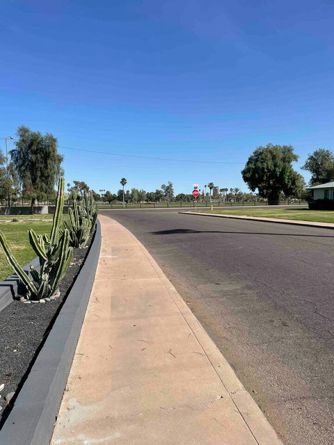 This is the Main Street 
Do not park along here please to avoid getting ticket or towed. 
Do not step on grass please 
Fell free to pick any golf ball if you need but stay out of grass as much as possible 