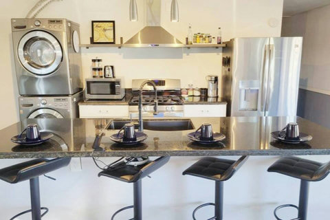 Fully stocked kitchen, full size washer & dryer, fridge with filtered water and ice maker, gas cooktop stove, not pictured is a countertop convention over/airfryer, slow cooker, indoor griddle, slow cooker and a rice maker.