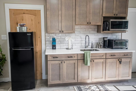 Fully stocked kitchenette for your light cooking needs with a fridge/freezer.